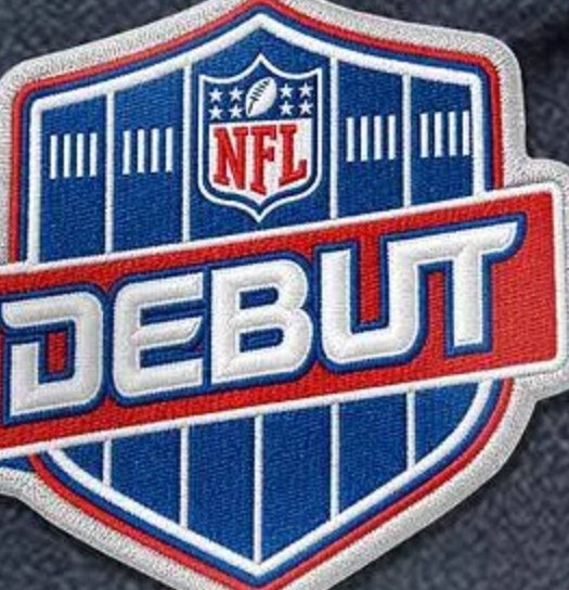 The NFL Debut patch: a blue shield with the NFL logo and DEBUT across a red band.